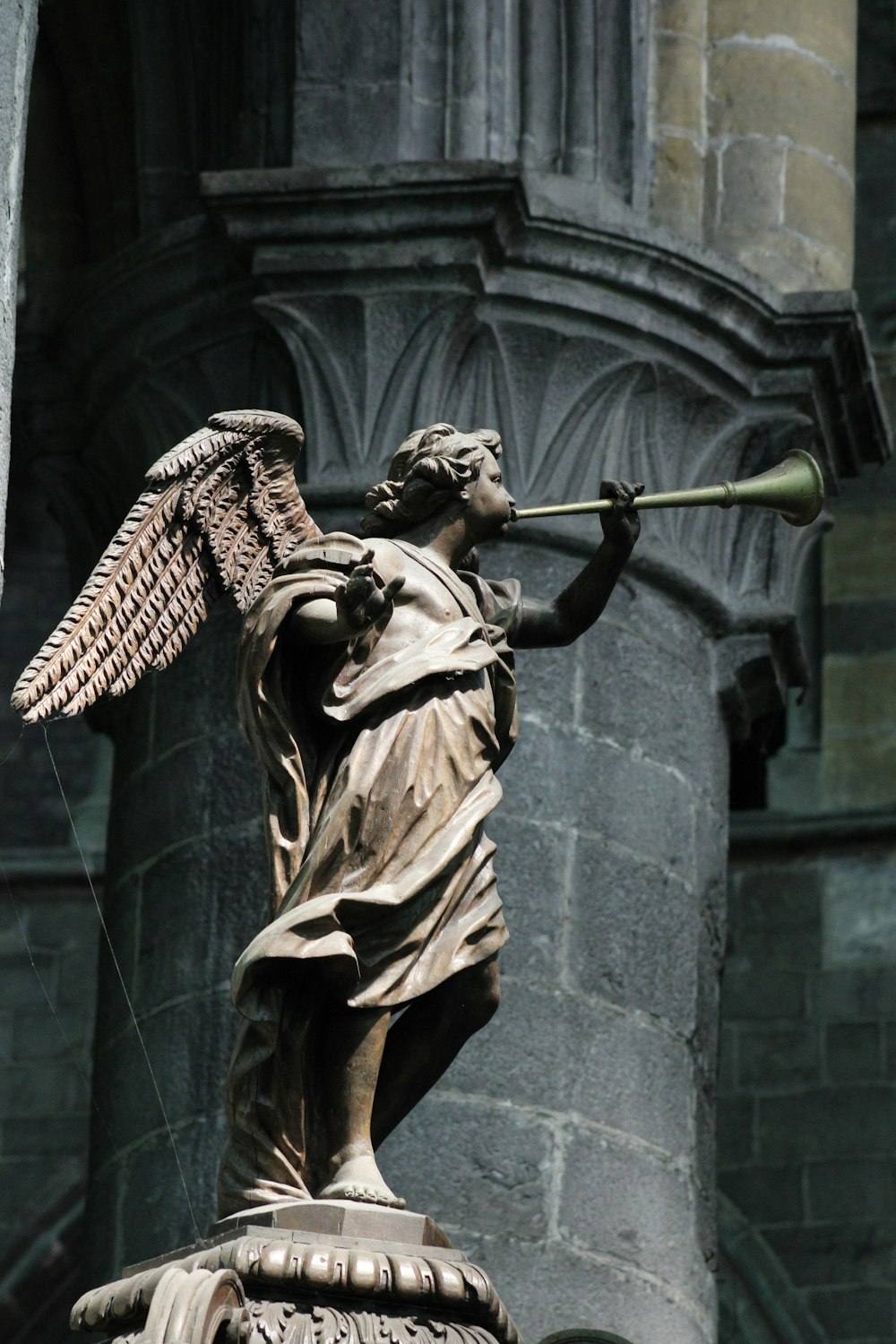 man holding a sword statue