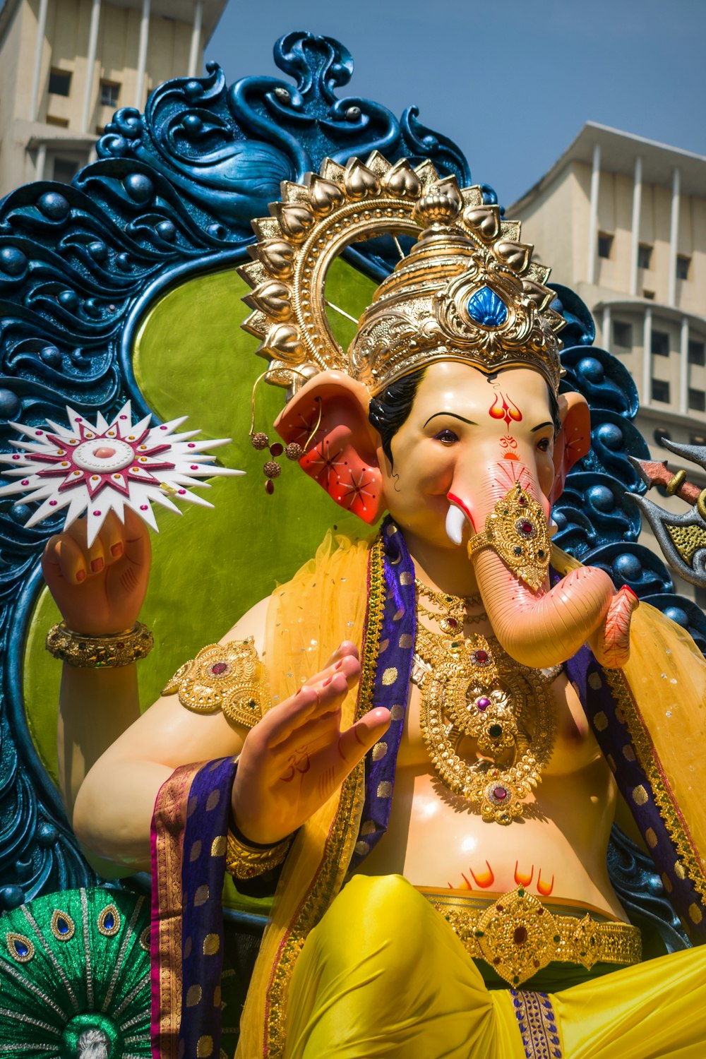 gold and purple hindu deity figurine