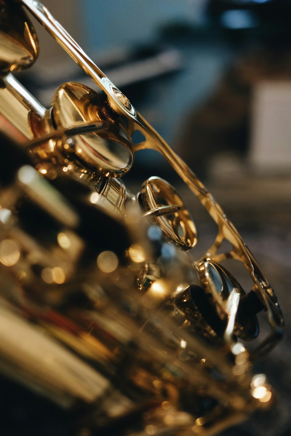 gold saxophone on black surface