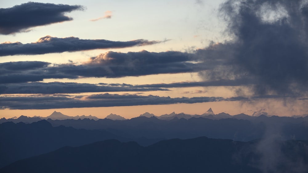 silhouette of mountains during sunset