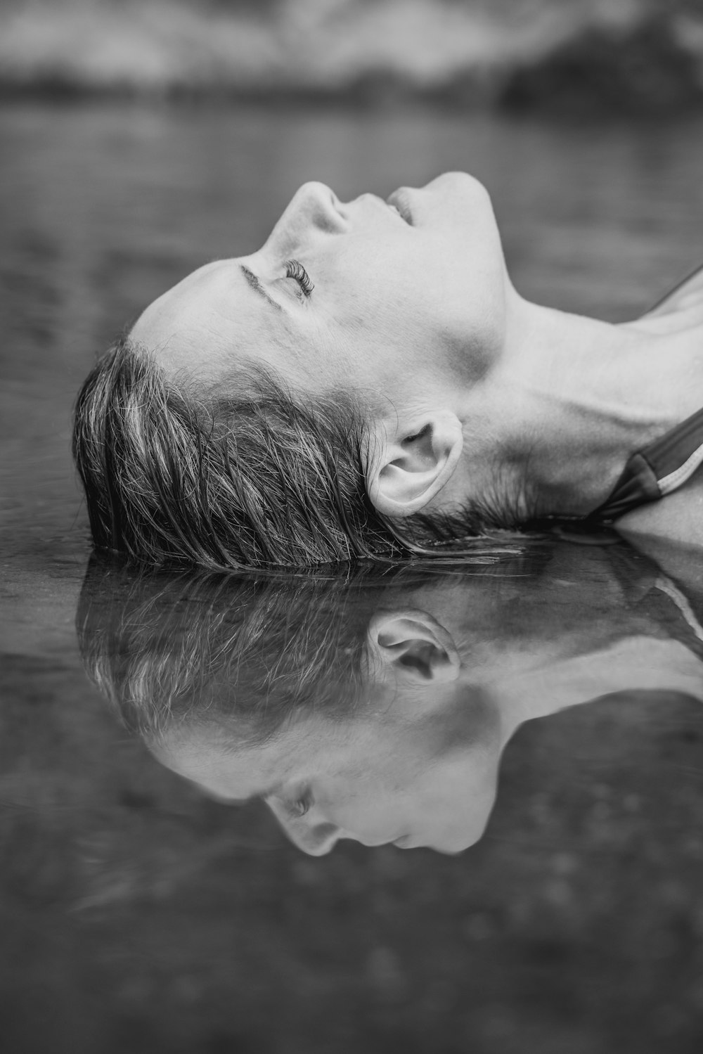 grayscale photo of woman in tank top