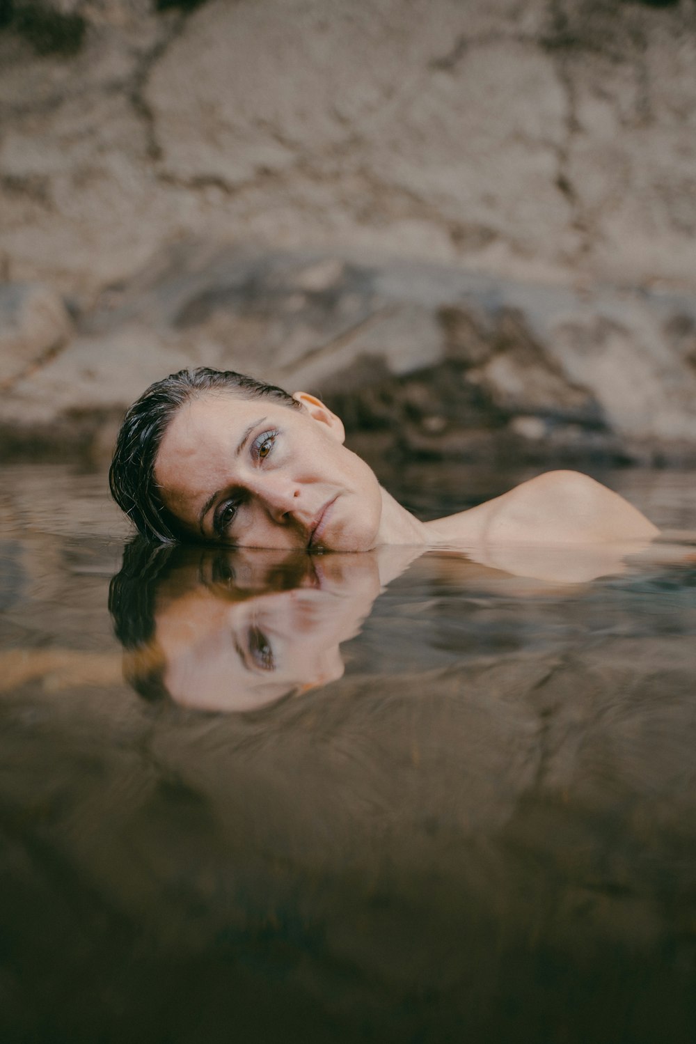 woman in white bikini top on water