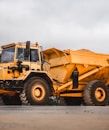 yellow and black heavy equipment on snow field