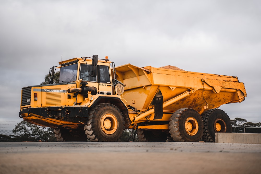 yellow and black heavy equipment on snow field