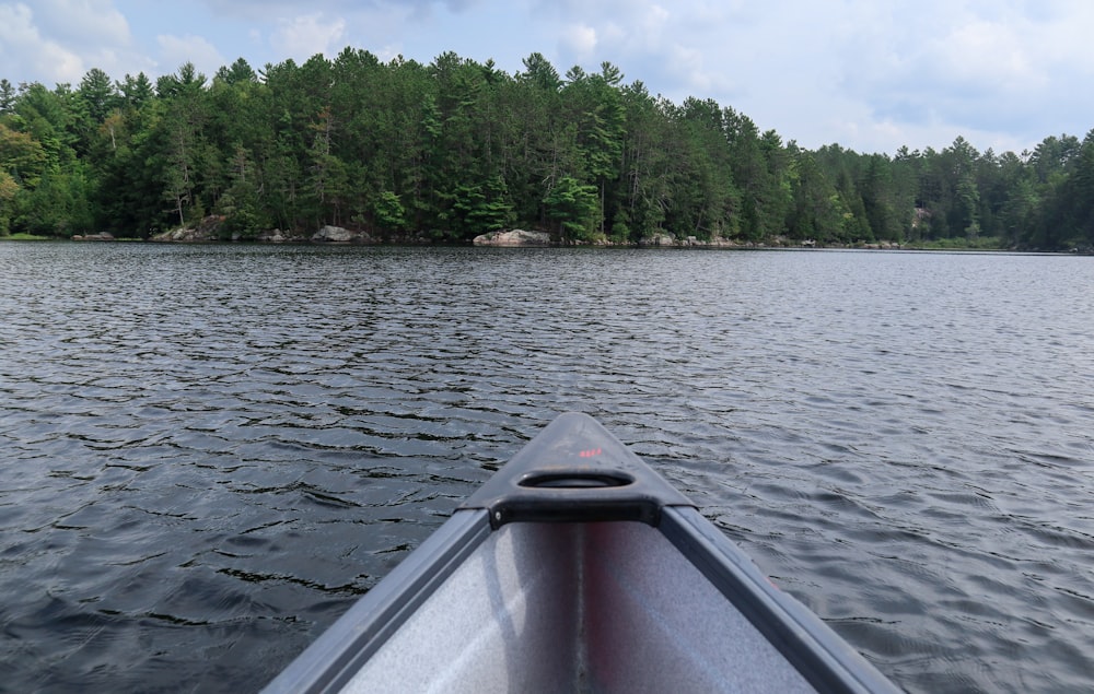 white boat on lake during daytime