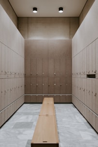 brown wooden door on blue and white floor tiles
