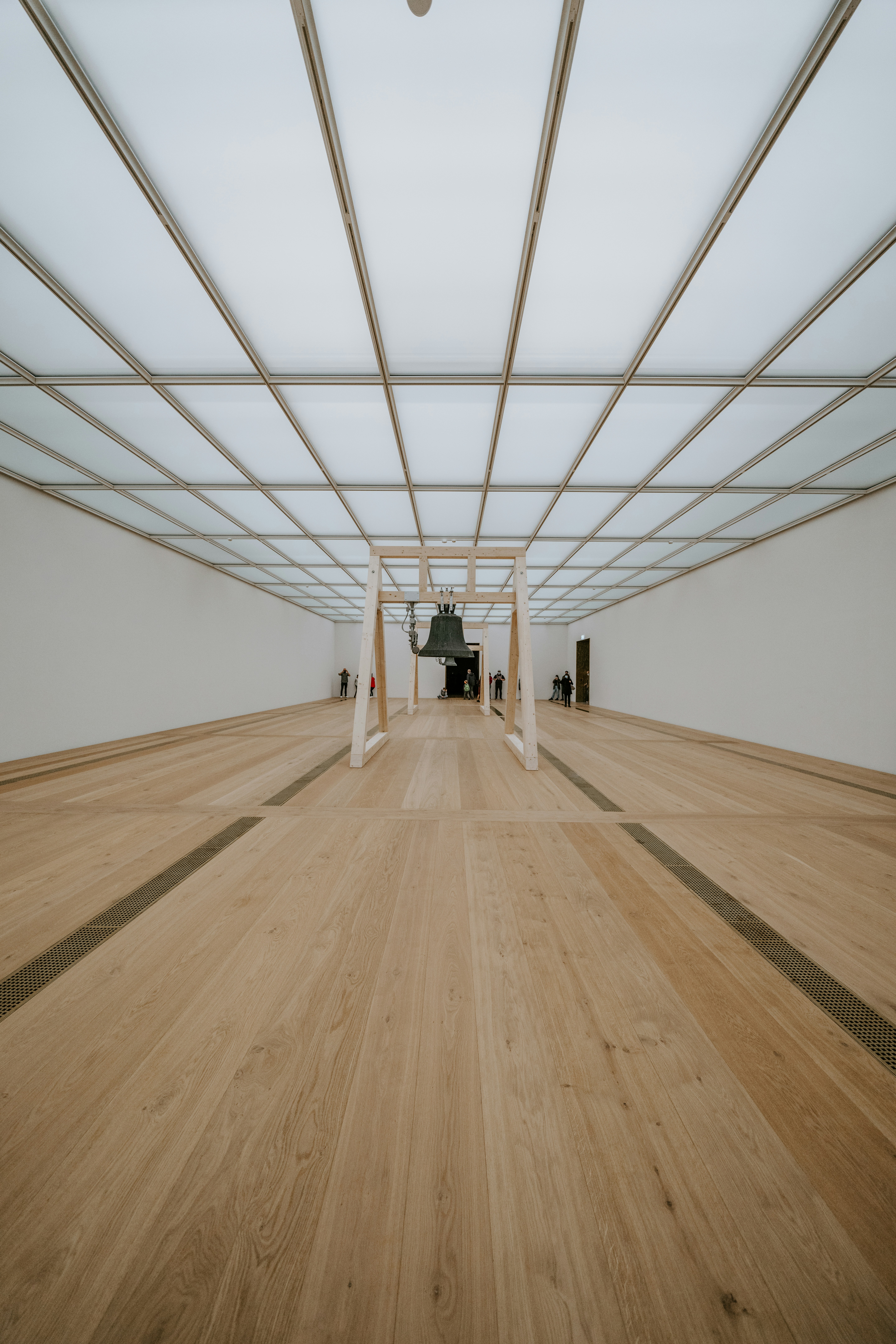 brown wooden parquet floor with white metal frame