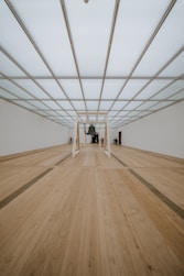 brown wooden parquet floor with white metal frame