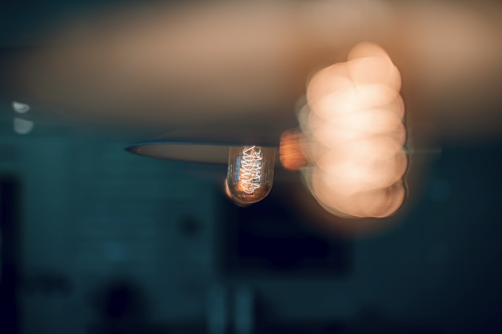 bokeh photography of brown lamp