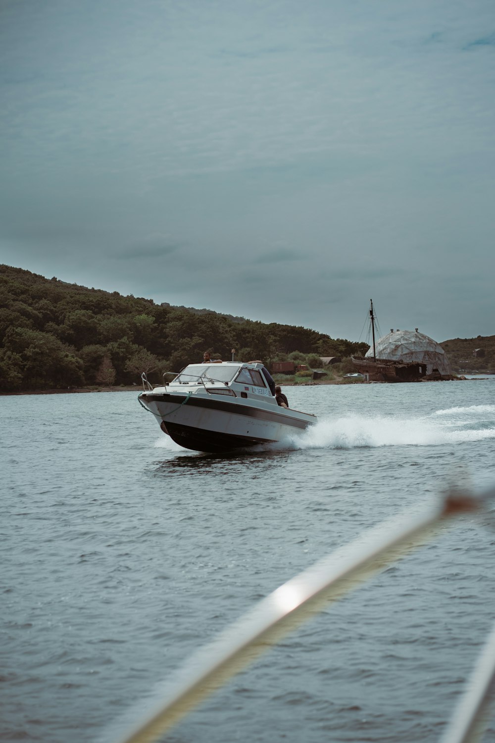 white and black boat on sea during daytime