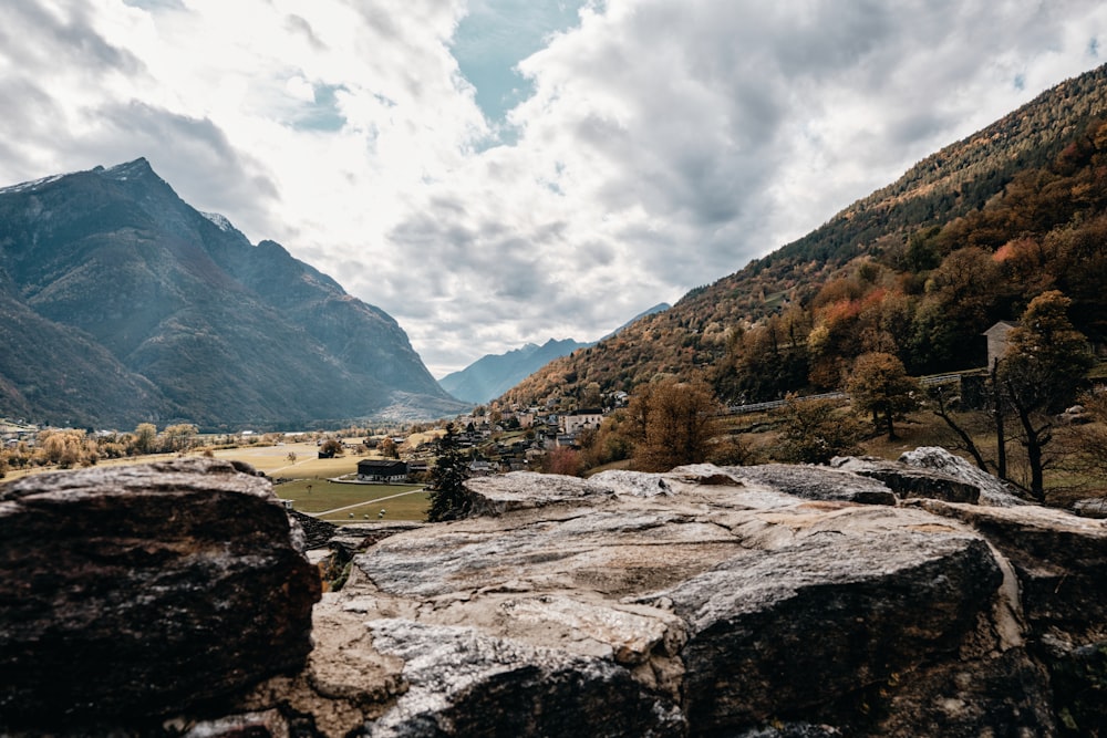 brown and green mountains under white clouds during daytime