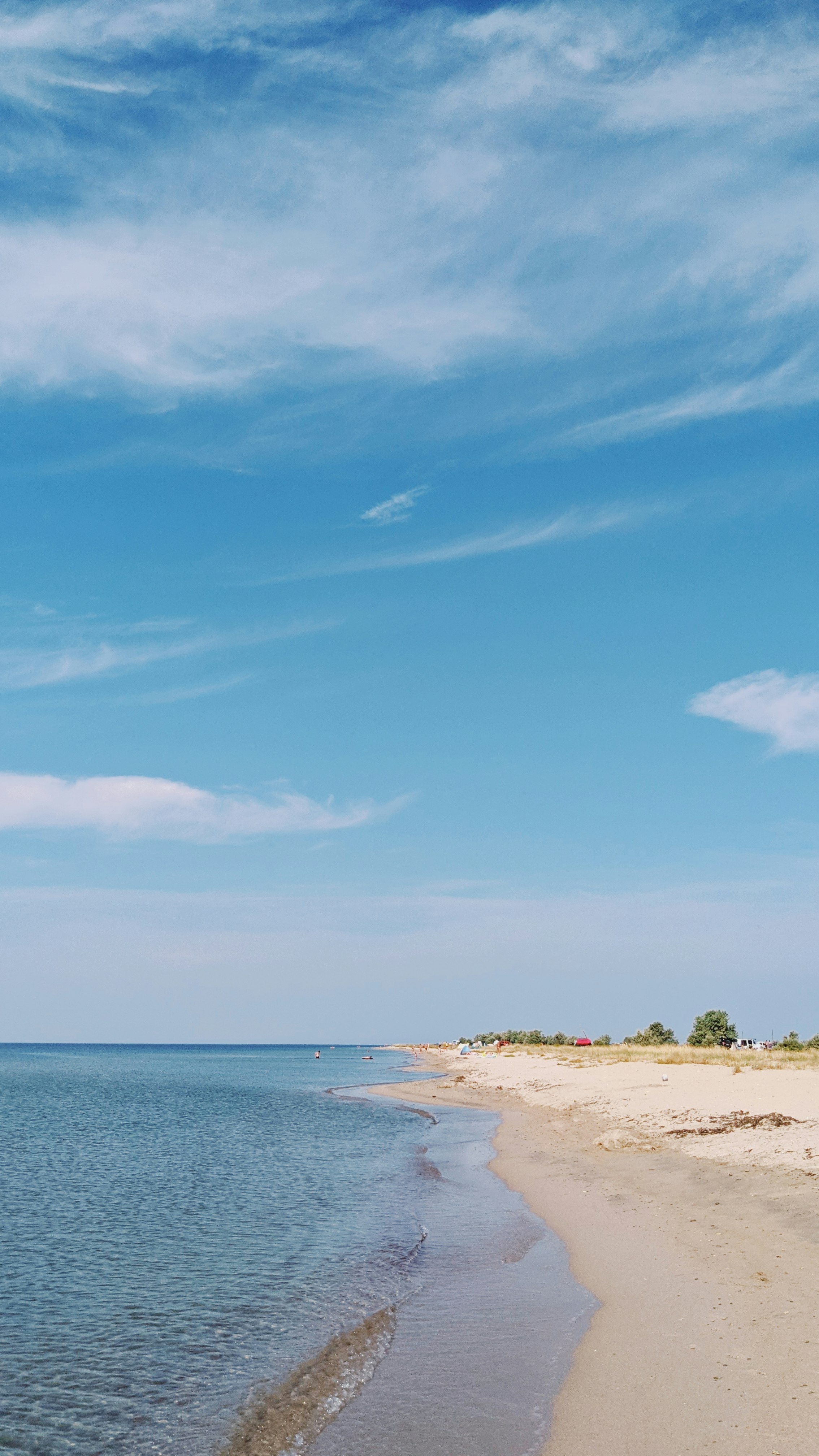 blue sky and white clouds over the beach