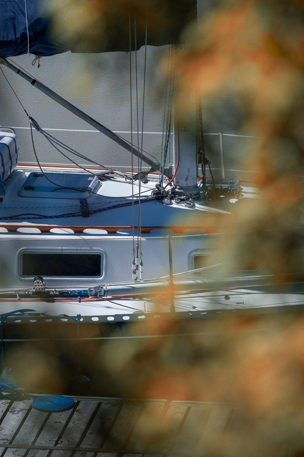 white and blue boat on body of water during daytime