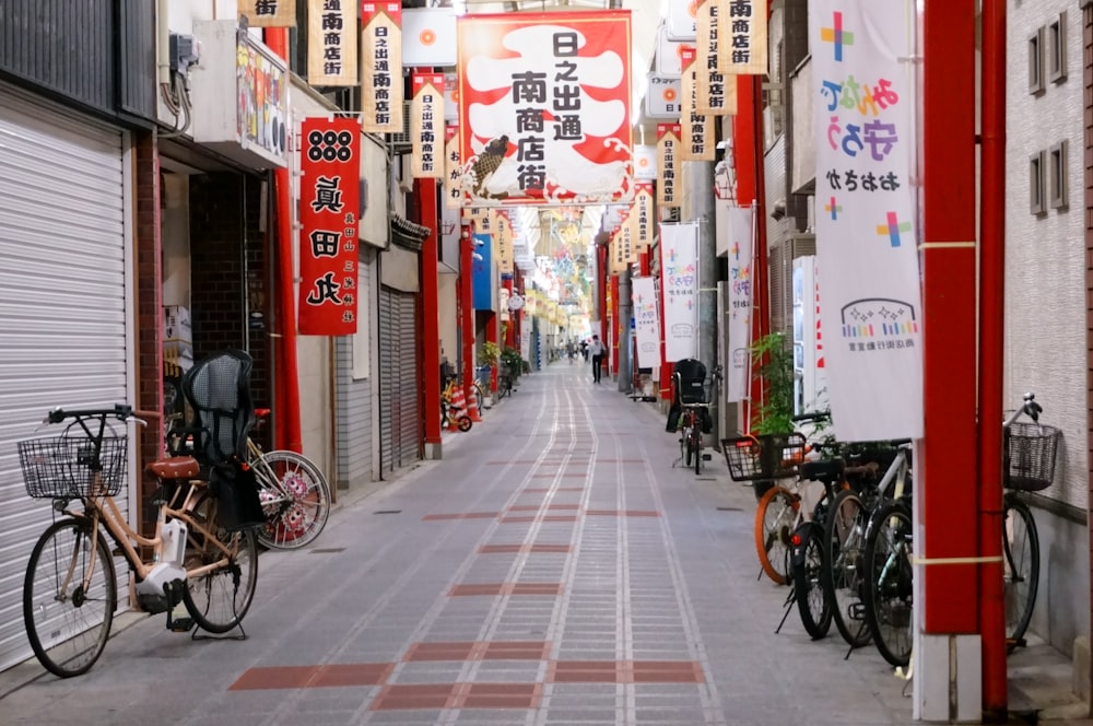 bicycles parked on sidewalk near buildings during daytime