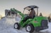 green and black john deere ride on lawn mower on snow covered ground during daytime