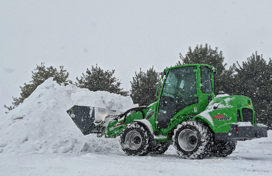 Wheel loader pushing and relocating a large pile of snow