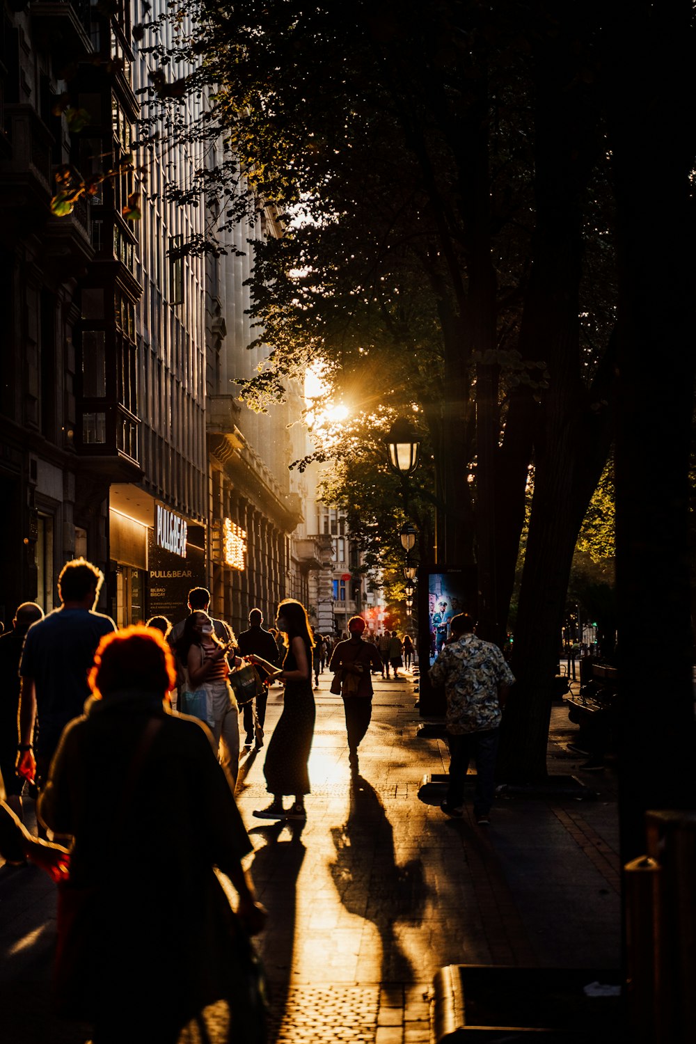 people walking on street during night time