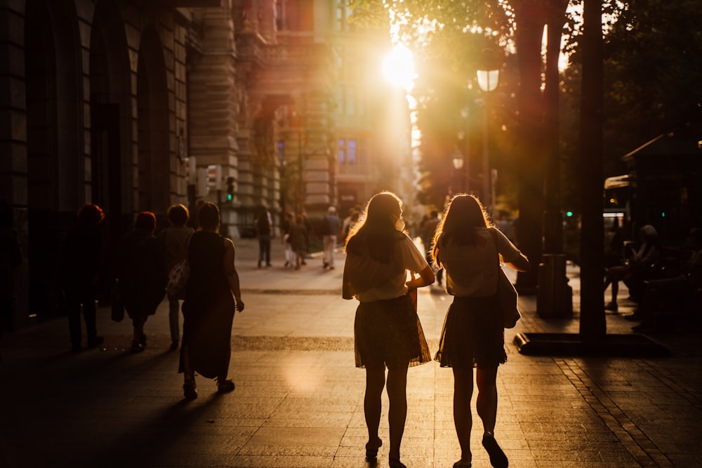 people walking on street during night time