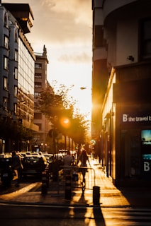 An urban scene at golden hour with shadows and light creating a peaceful yet dynamic composition