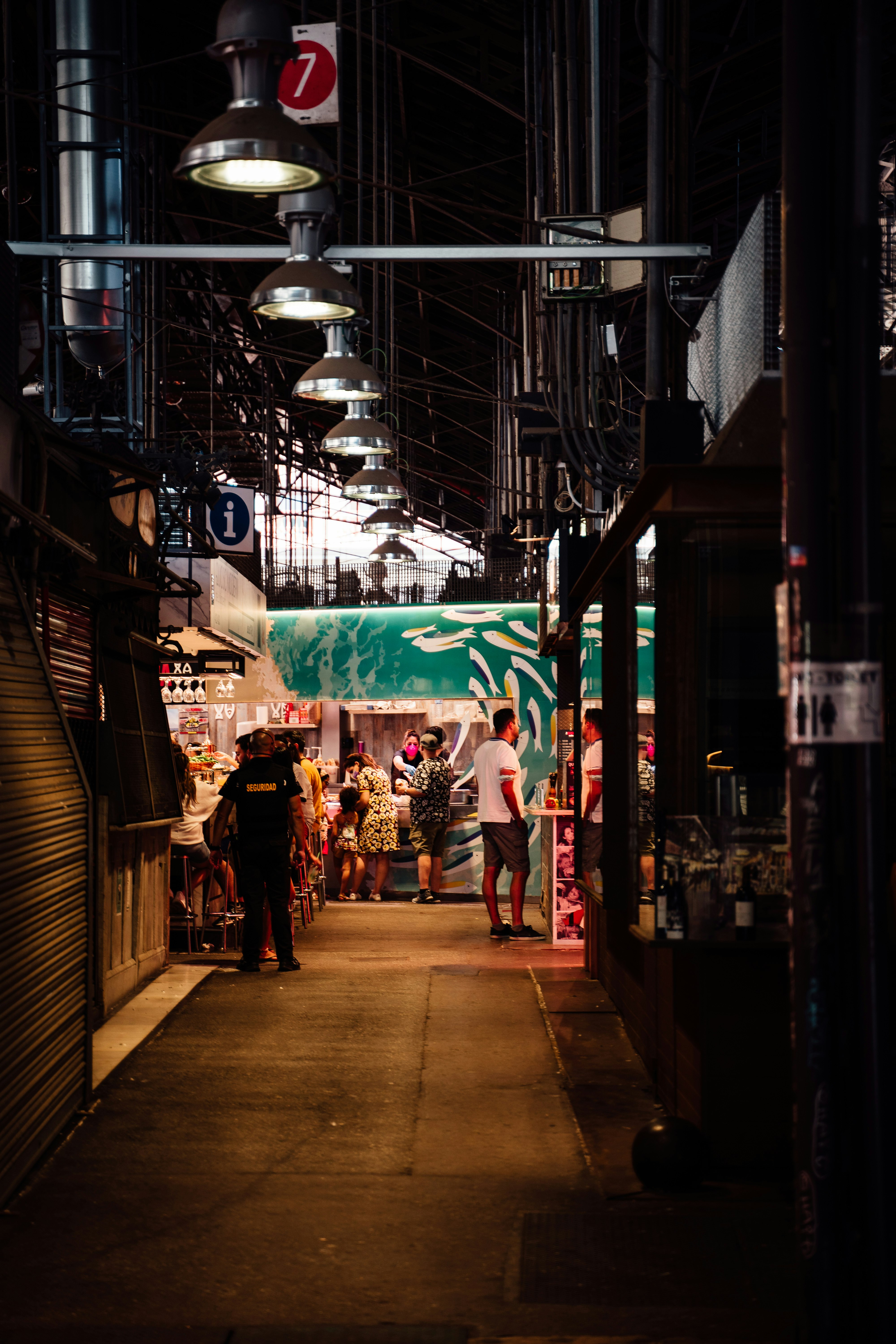 people walking on street during nighttime