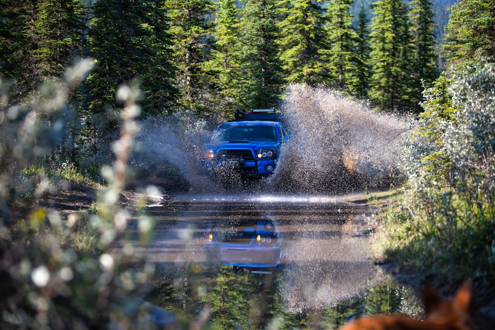 blue car on road during daytime