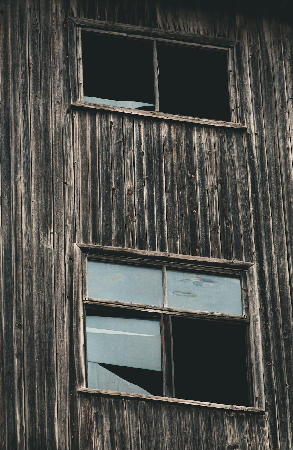 brown wooden window frame on brown wooden wall