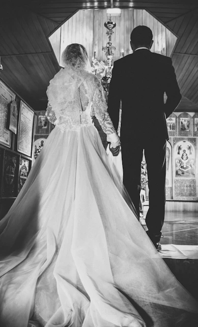 grayscale photo of woman in white wedding gown