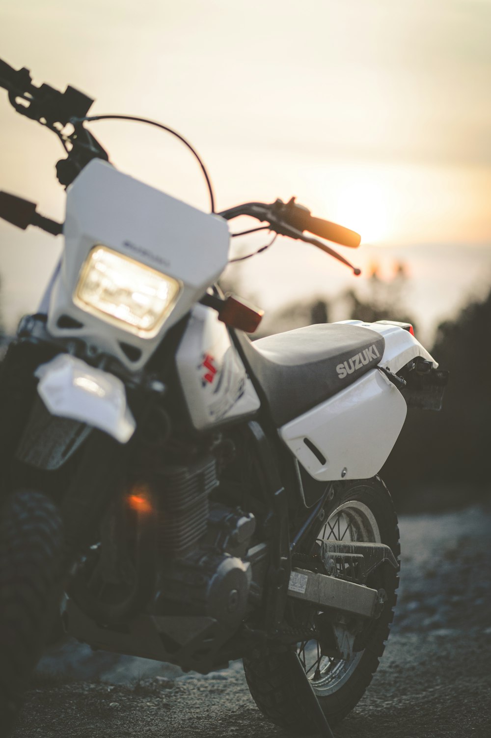 black and white motorcycle during sunset