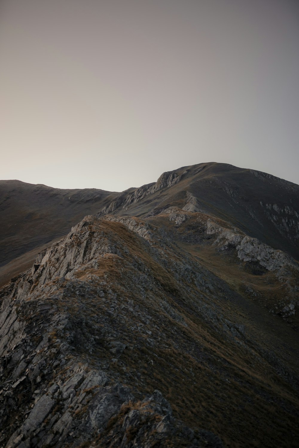 brown and green mountain under white sky during daytime