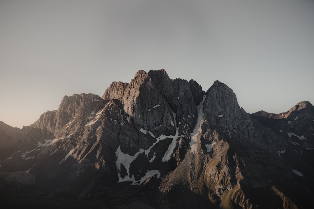 brown rocky mountain under white sky during daytime