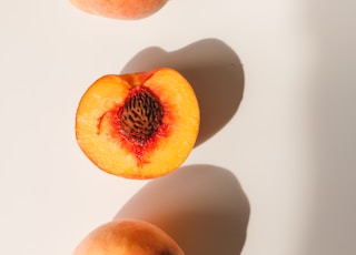 2 red and yellow peach fruits