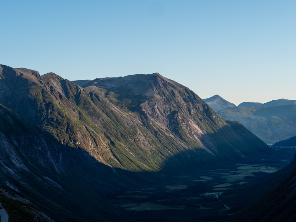 brown and green mountains under blue sky during daytime