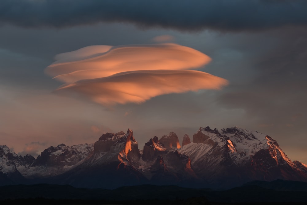 black and white mountains under orange sky