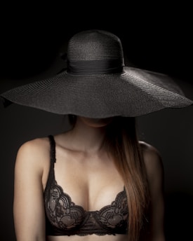 woman in black and white hat