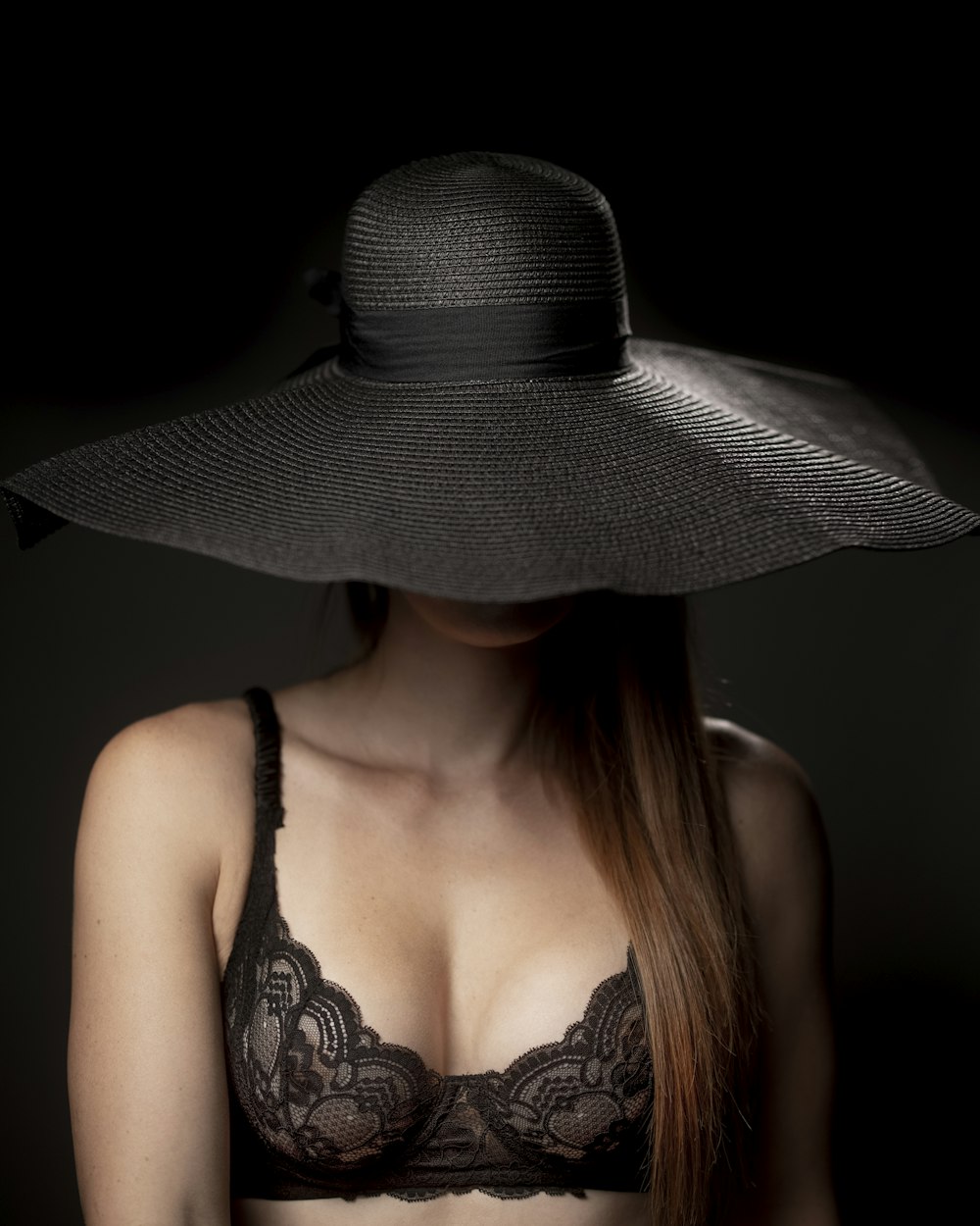 woman in black and white hat