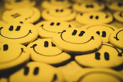 yellow and black round cookies smiling