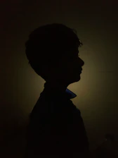 Professional portrait of Chandan Shastri with a soft glowing aura and subtle cosmic background.
