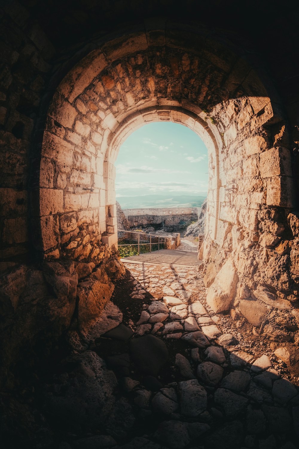 brown brick tunnel during daytime