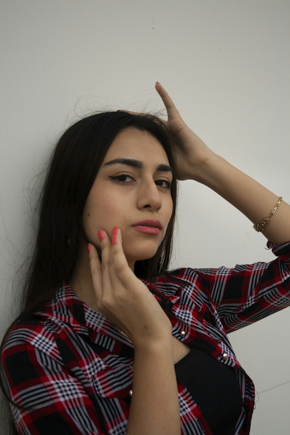 woman in red and white plaid dress shirt