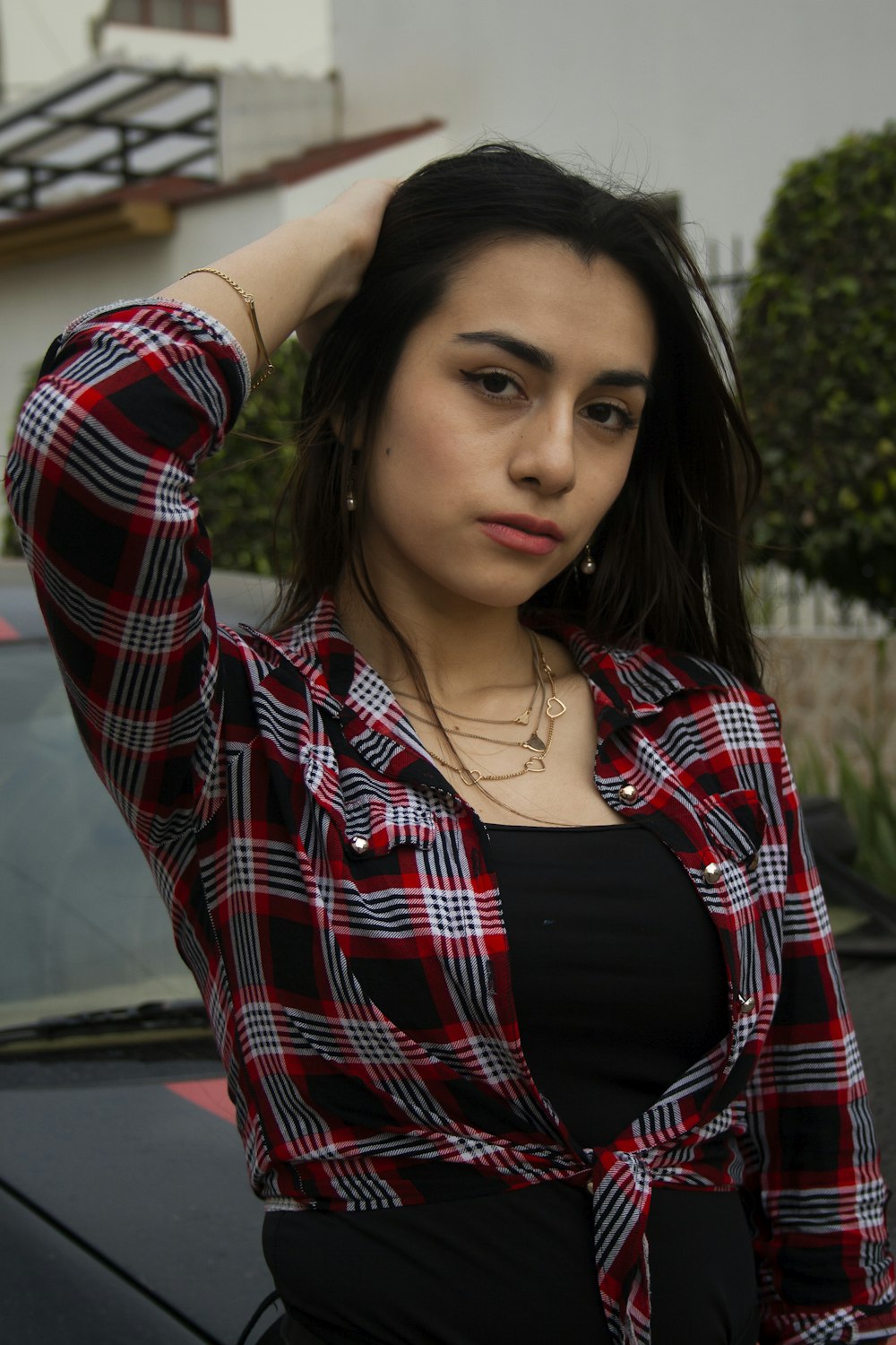 woman in red and white plaid dress shirt