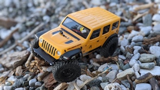 yellow and black jeep wrangler scale model