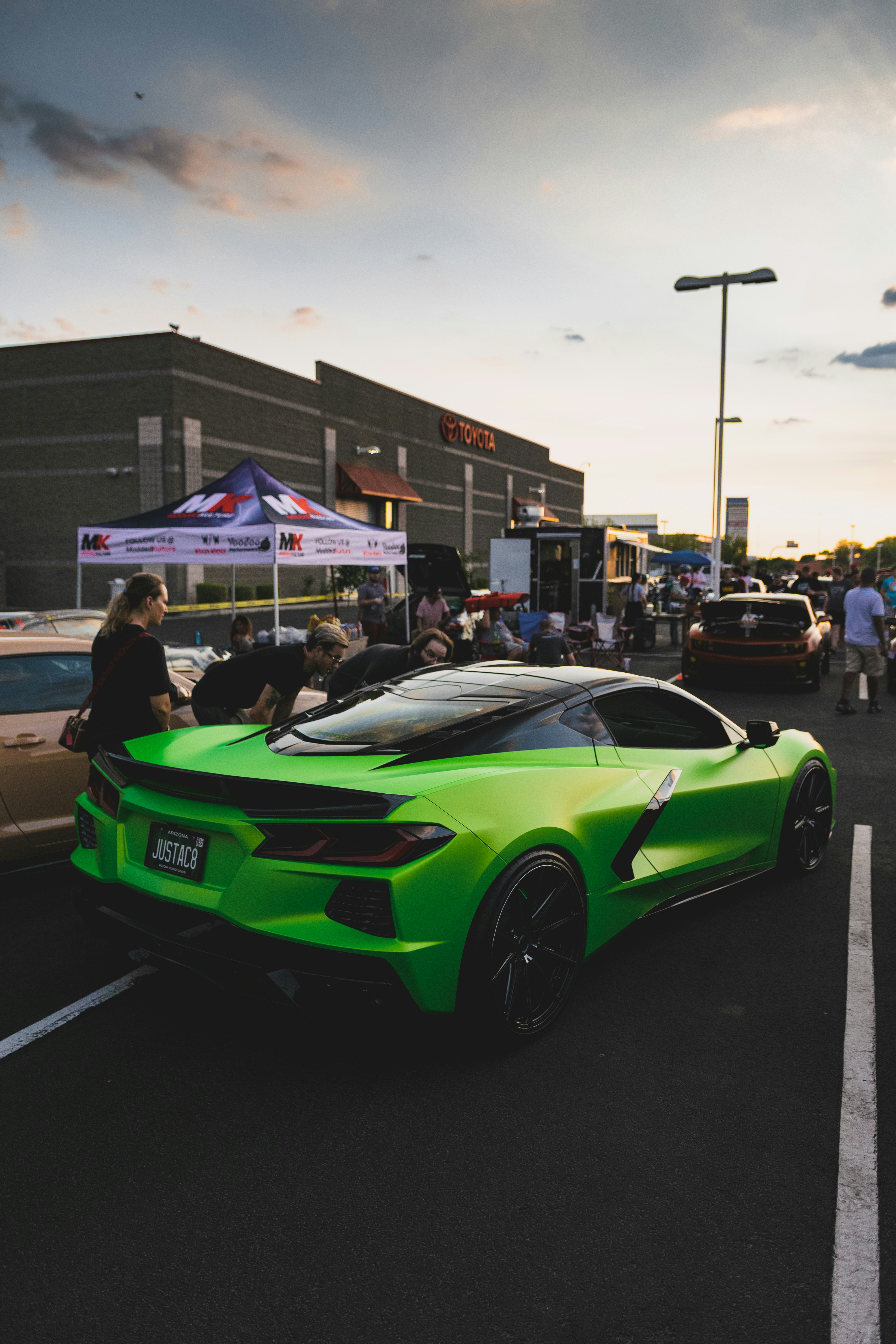 green chevrolet camaro on road during daytime