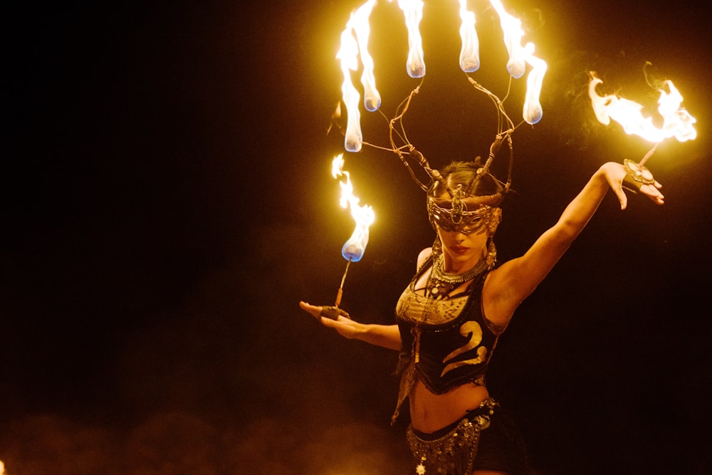 woman in black and white floral bikini holding fire