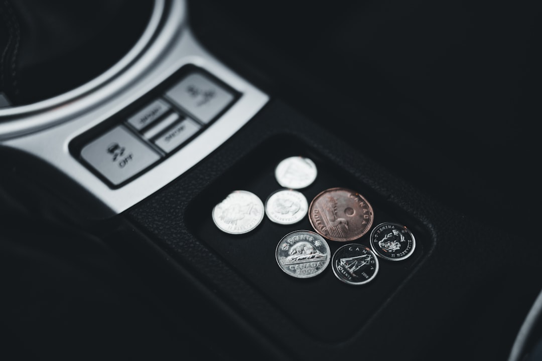 silver coins on black surface