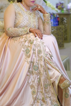woman in beige floral dress