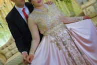 A couple dressed in elegant attire for a family event.