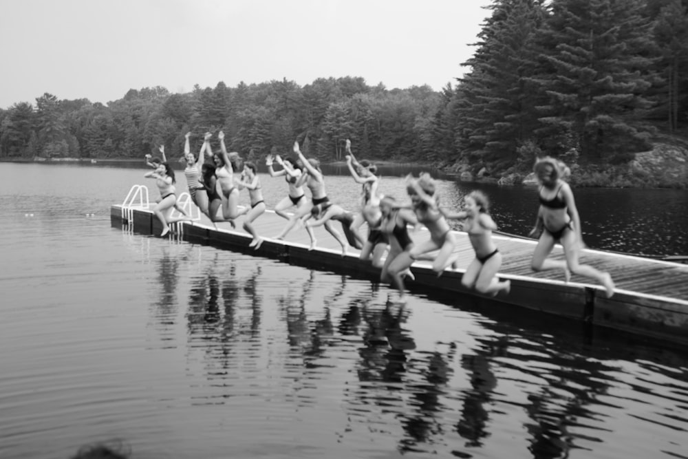 people sitting on boat on lake during daytime