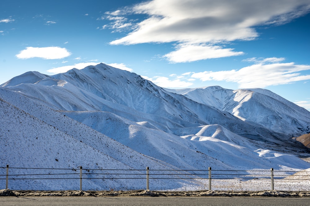 snow covered mountains under blue sky during daytime