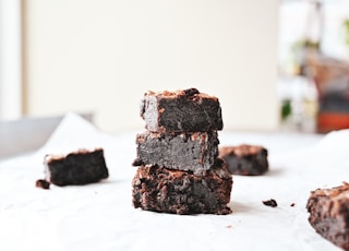 brown and black chocolate cake on white table