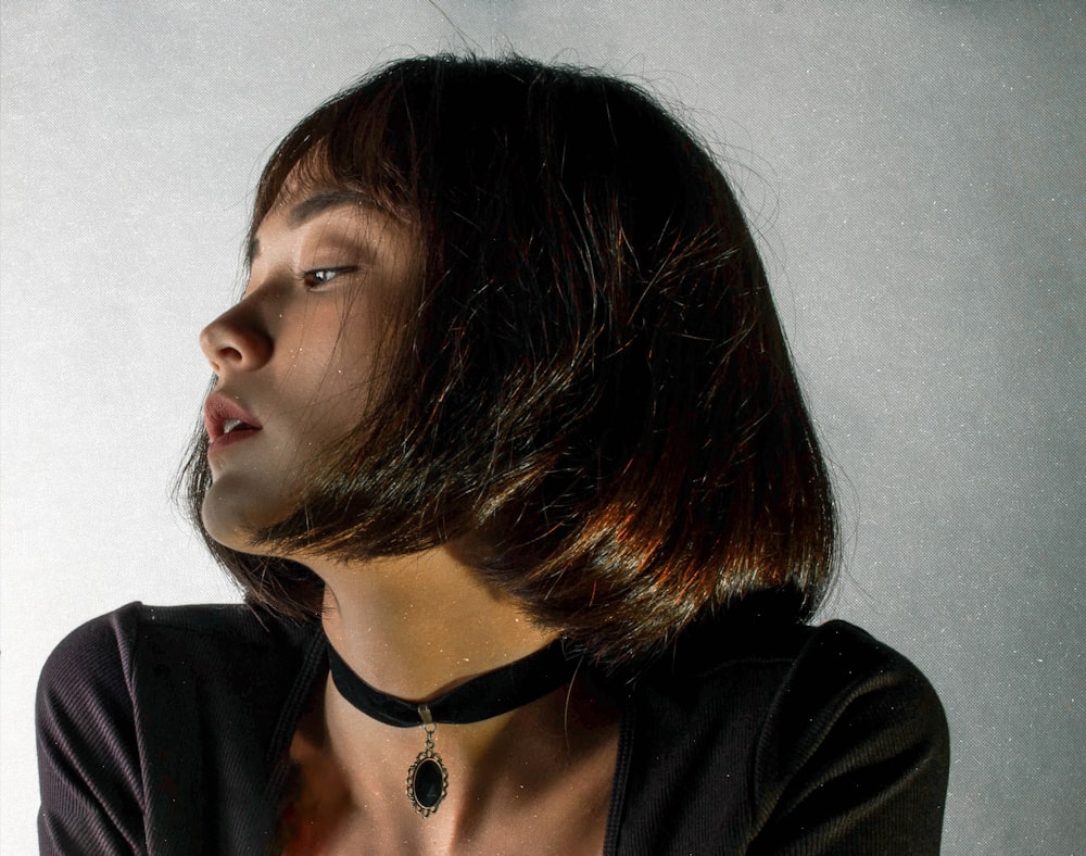 woman in black shirt with black hair